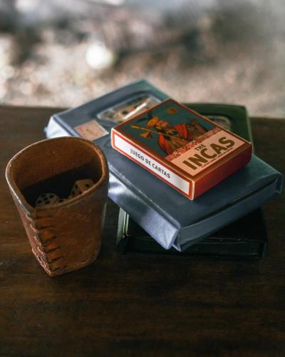 a book and a cup sitting on a table at El Vijo Surf in Nuquí