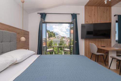Un pat sau paturi într-o cameră la Villa Senzen