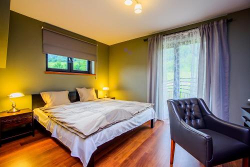 Cama ou camas em um quarto em Otulina Park