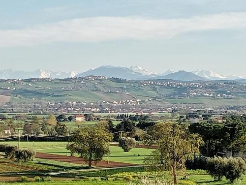 a view of a city with mountains in the background at Agriturismo Ponterosa in Morrovalle