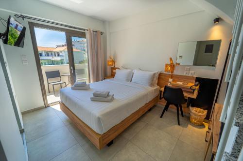 Posteľ alebo postele v izbe v ubytovaní Niso Skiathos