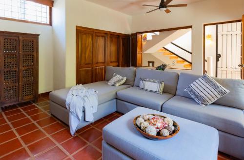 a living room with a couch and a table at Villa Monte in Sayulita