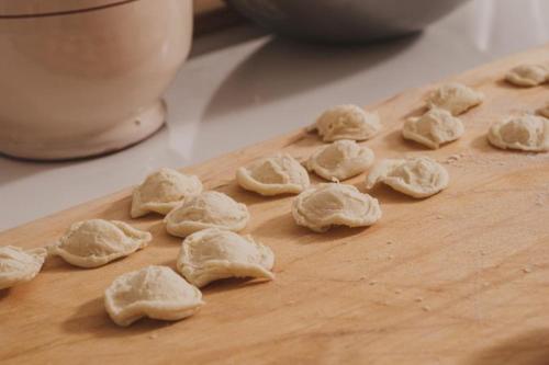 a group of uncooked dough on a cutting board at Sei Stelle Mama in Polignano a Mare