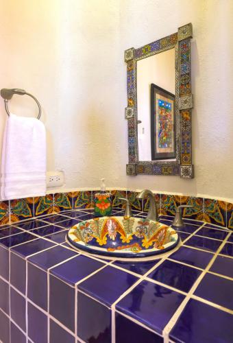 a bathroom counter with a sink and a mirror at Villa Monte in Sayulita