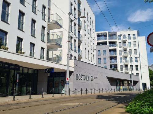 an empty street in front of a building at Mostowa 23 BRUNO Apartment, self check-in 24h, free parking, air-conditioning in Poznań