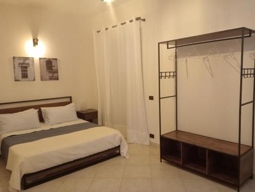 a bedroom with a bed and a shower in it at Villa Gelsemium in Siracusa