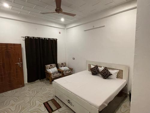 Cama o camas de una habitación en Govind Atithi Grah