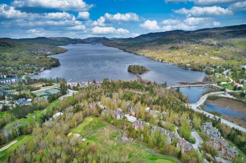 an aerial view of a town and a river at Tremblant Les Eaux by Rendez-Vous Mont-Tremblant in Mont-Tremblant