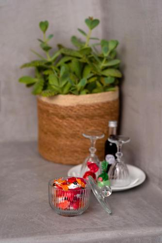 a table with a bowl of food and a plant at 1812 Caves 'n Mansion in Karterados