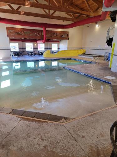 a swimming pool with a yellow raft in the water at The Dakota in Sioux Falls
