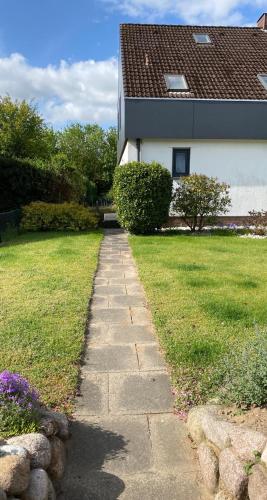 a stone path in front of a house at Ferienwohnung in Bad Segeberg in Bad Segeberg