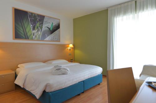 Postel nebo postele na pokoji v ubytování Vital Hotel Flora