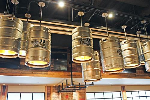 a bunch of gold buckets hanging from the ceiling at Isle of Capri Boonville, A Caesars Destination in Boonville