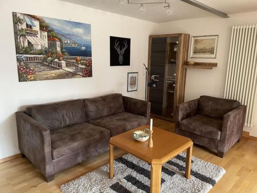 a living room with a couch and a coffee table at Ferienwohnung Meridiana in Tuntenhausen