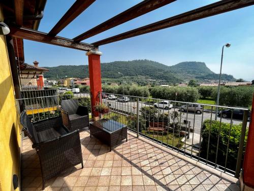 a balcony with a view of a parking lot at Apartment-Rosella Garda in Garda