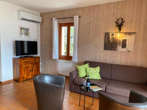 a living room with a couch and a tv at Casa Paola in Vesta
