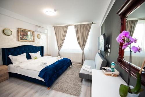 Ένα ή περισσότερα κρεβάτια σε δωμάτιο στο SIA Residence
