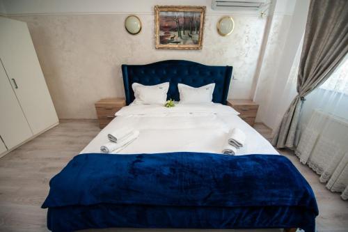 Ένα ή περισσότερα κρεβάτια σε δωμάτιο στο SIA Residence