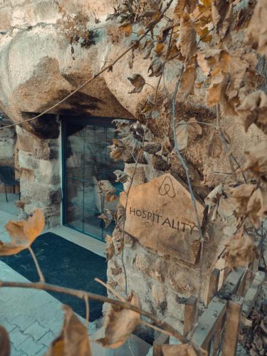 a sign on the side of a building at Deep Cave House in Urgup