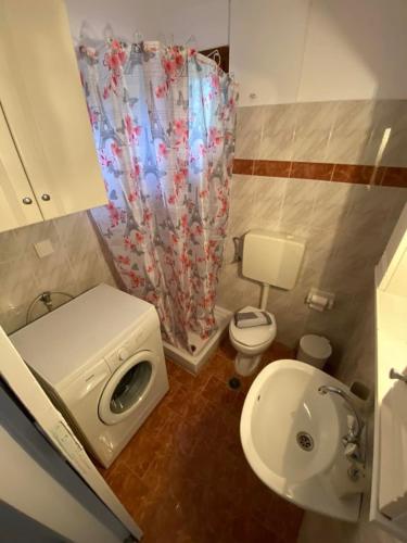 a small bathroom with a toilet and a sink at View Sea House in Kato Gatzea