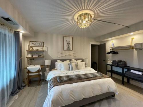 a large bedroom with a large bed and a desk at 2 Bd/3 Ba, Luxury Ski-in Ski Out Condo - Sleeps 10 in Park City