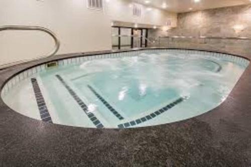 a large pool of water in a room with at 2 Bd/3 Ba, Luxury Ski-in Ski Out Condo - Sleeps 10 in Park City