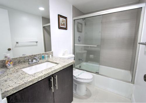 a bathroom with a sink and a toilet and a shower at Miami Hollywood Two Bedroom Penthouse With Intracoastal View 005-22bvic in Hollywood