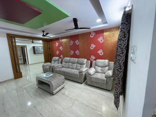 a living room with two couches and a table at Servostay Furnished 3 BHK in Prime Location Near Arilova - 3rd Floor in Visakhapatnam