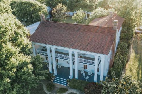 an overhead view of a white house with a red roof at Luxury historic house in downtown McKinney in McKinney
