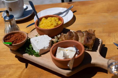 a plate of food with different types of food on a table at Baba I Dede in Galičnik