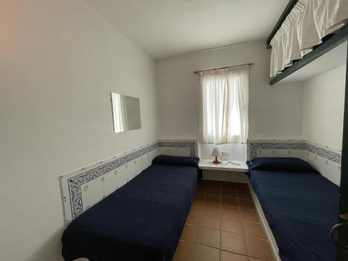 Postel nebo postele na pokoji v ubytování ERMITA by SOM Menorca