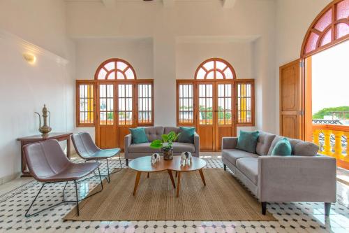 a living room with two couches and a table at Casa Morales Getsemaní in Cartagena de Indias