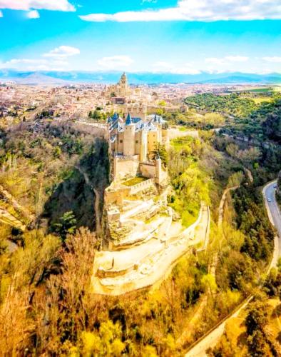 an aerial view of a castle on a mountain at Hostal Juan Bravo in Segovia
