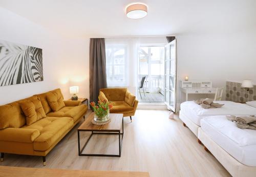 Postel nebo postele na pokoji v ubytování Hotel Villa Granitz