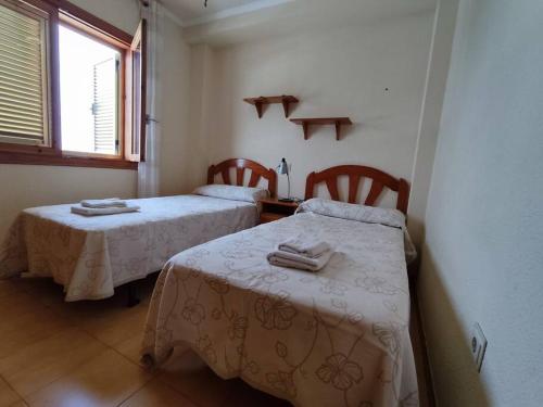 Posteľ alebo postele v izbe v ubytovaní Apartamento cómodo a 300 metros de la playa