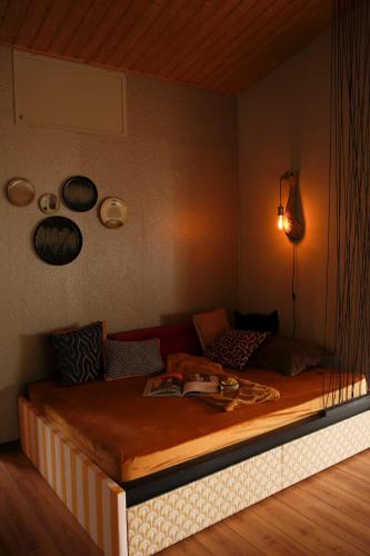 a bedroom with a large bed with a wooden floor at Tukken op de Maashorst in Schayk