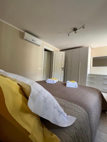 a bedroom with a bed with pillows on it at Al Lago da Lilly in Gargnano