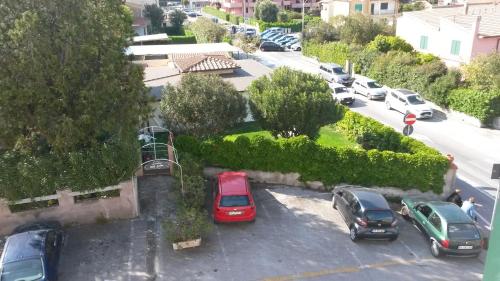 a group of cars parked in a parking lot at Hotel Anselmi in Marciana Marina