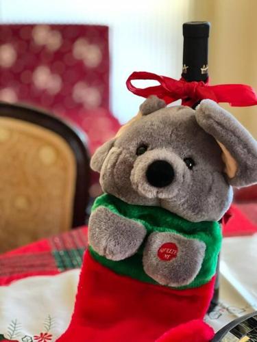 a stuffed teddy bear with a top hat on a table at Ανάμεσα στα Έλατα in Ayía Varvára