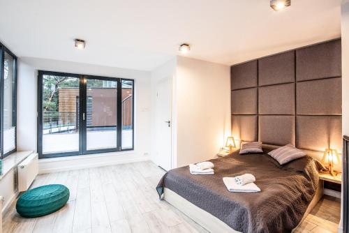 Katil atau katil-katil dalam bilik di Baltica Heaven by 2HomeRent