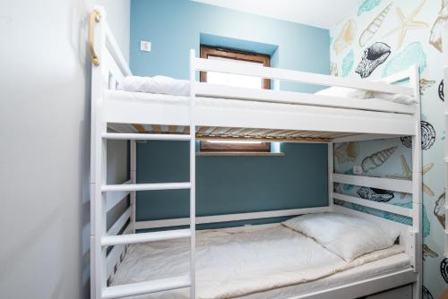 Katil atau katil-katil dalam bilik di Baltica Heaven by 2HomeRent