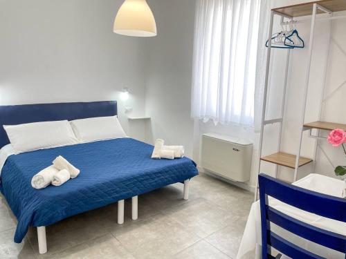 Postel nebo postele na pokoji v ubytování Tea House Alghero