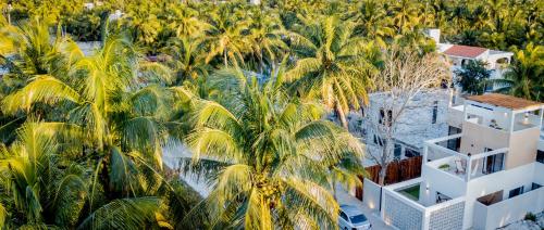 an aerial view of a resort with palm trees at Casa Arrayan Telchac in Telchac Puerto