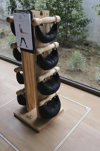 a wooden wine rack with black wine bottles at Maravilla Luxury Living in Kos Town