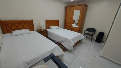 Ένα ή περισσότερα κρεβάτια σε δωμάτιο στο Ramses Guest House