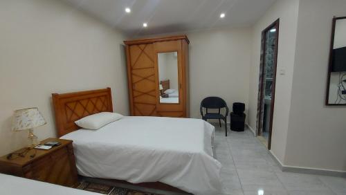 Ένα ή περισσότερα κρεβάτια σε δωμάτιο στο Ramses Guest House