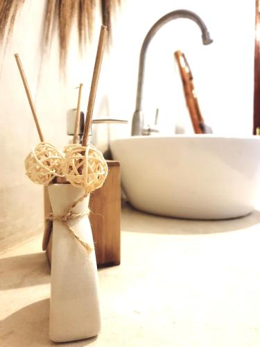 a kitchen counter with a sink and a knife holder at Michamvi Spirit Lodge in Michamvi