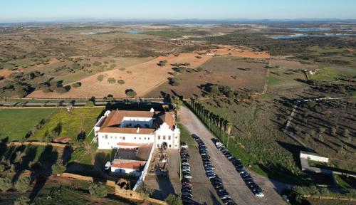 an aerial view of a house with cars parked in a driveway at Convento da Orada - Monsaraz in Monsaraz