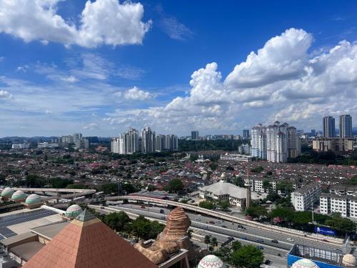 a view of a city with buildings in the background at Resort Suites By Newcityhome in Petaling Jaya