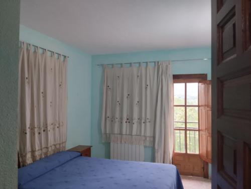 Ένα ή περισσότερα κρεβάτια σε δωμάτιο στο Apartamentos Condado de Miranda